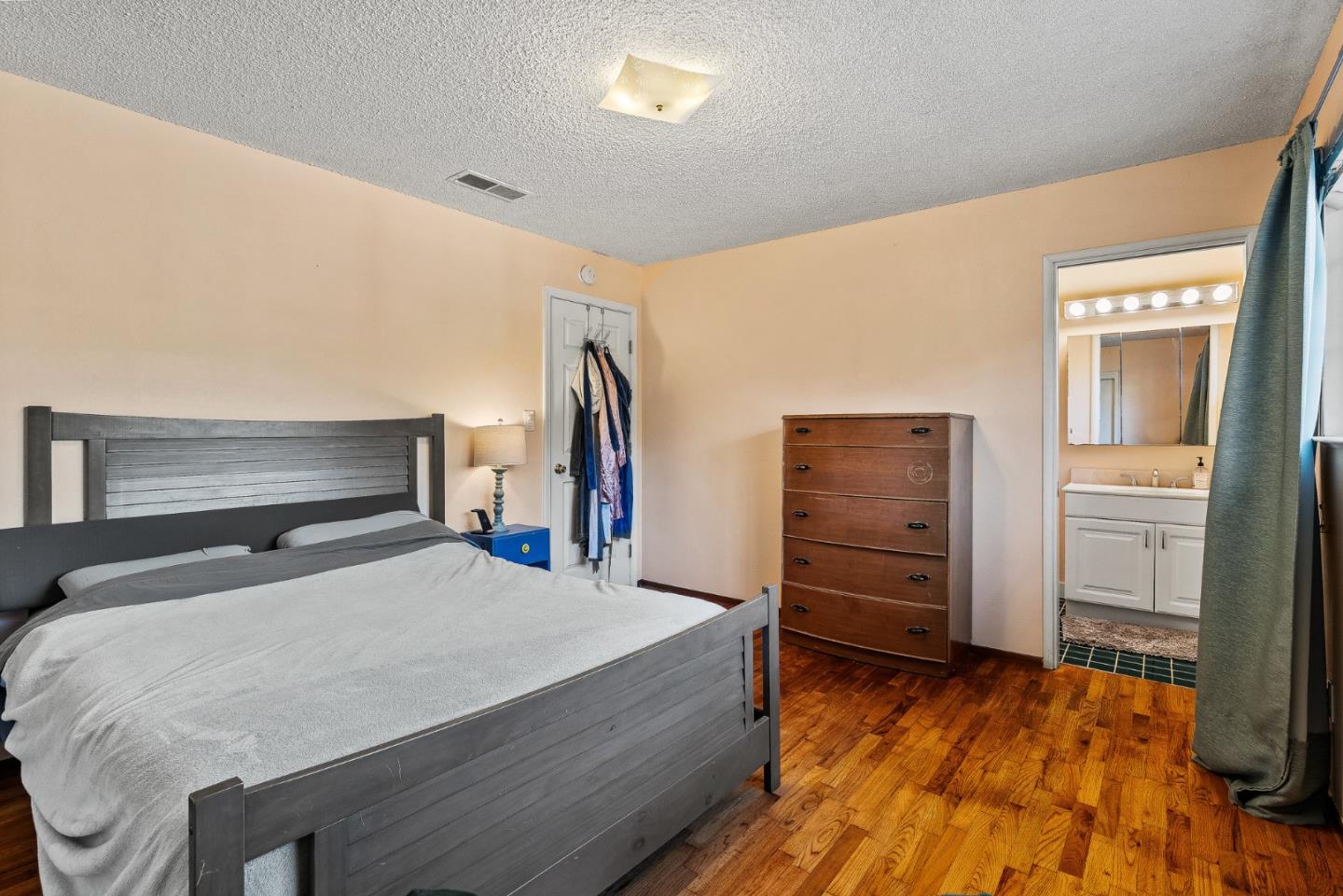 842 Central Avenue Salinas, CA 93901 - Photo 11 of 24 a bedroom with a bed and cabinet