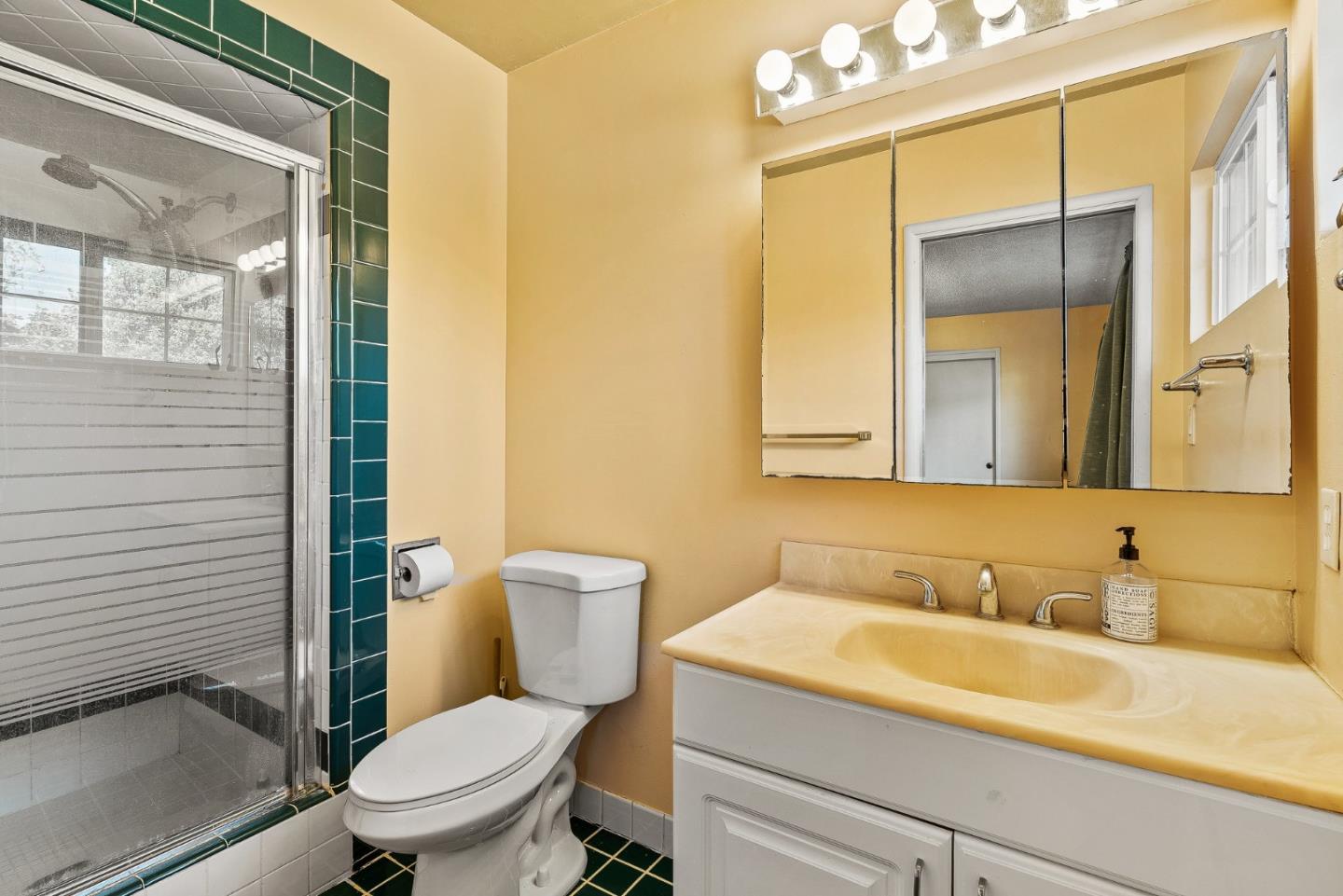842 Central Avenue Salinas, CA 93901 - Photo 18 of 24 a bathroom with a granite countertop sink mirror vanity and toilet