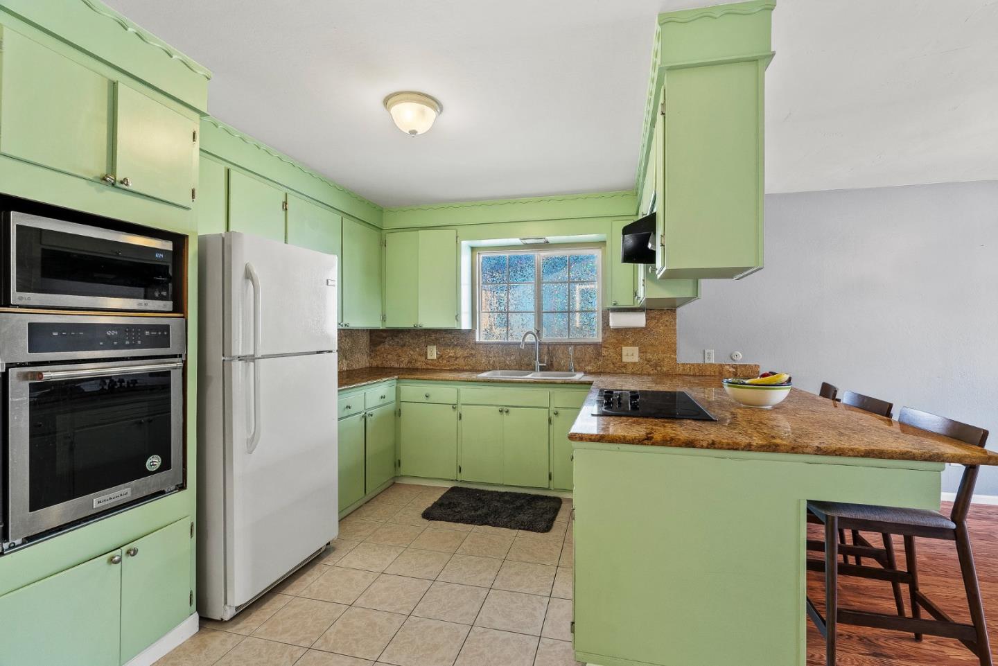 842 Central Avenue Salinas, CA 93901 - Photo 19 of 24 a kitchen with a refrigerator and a sink