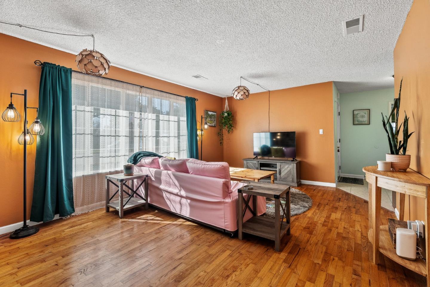 842 Central Avenue Salinas, CA 93901 - Photo 7 of 24 a living room with furniture and a wooden floor
