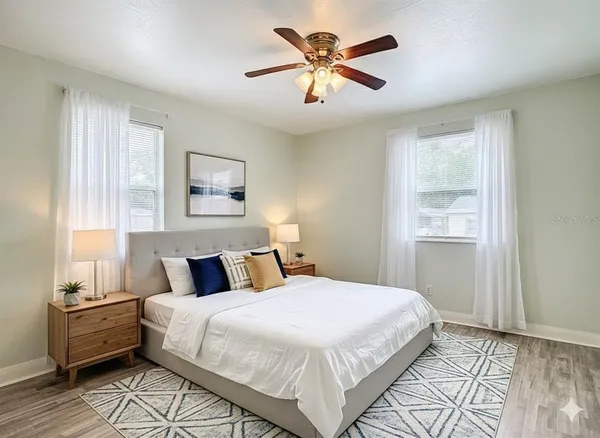 a bedroom with a large bed and a window