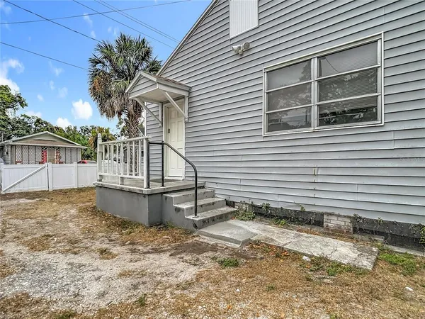 a house with a tree in front of it