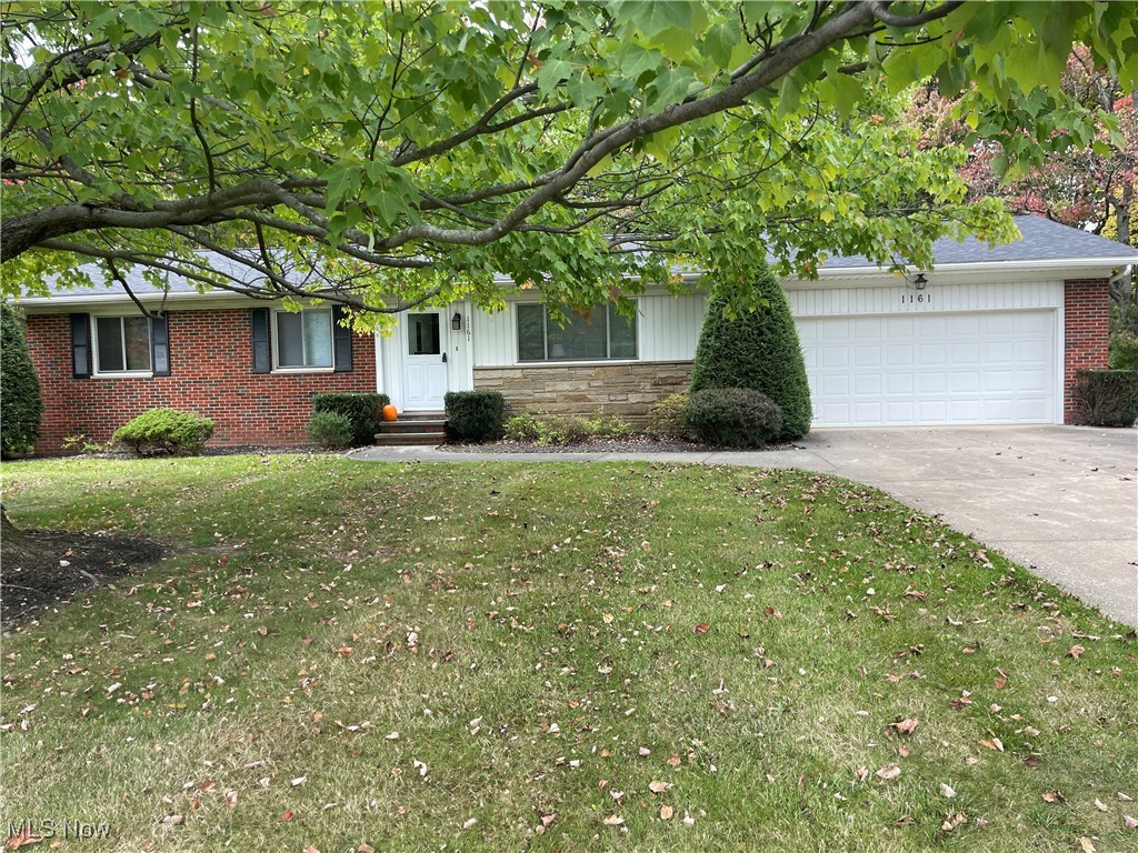 1161 Ledgeview Road Macedonia, OH 44056 - Photo 1 of 4 View of front of house with a garage and a front lawn
