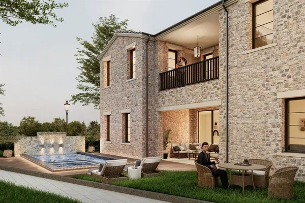 a front view of a house with garden and patio