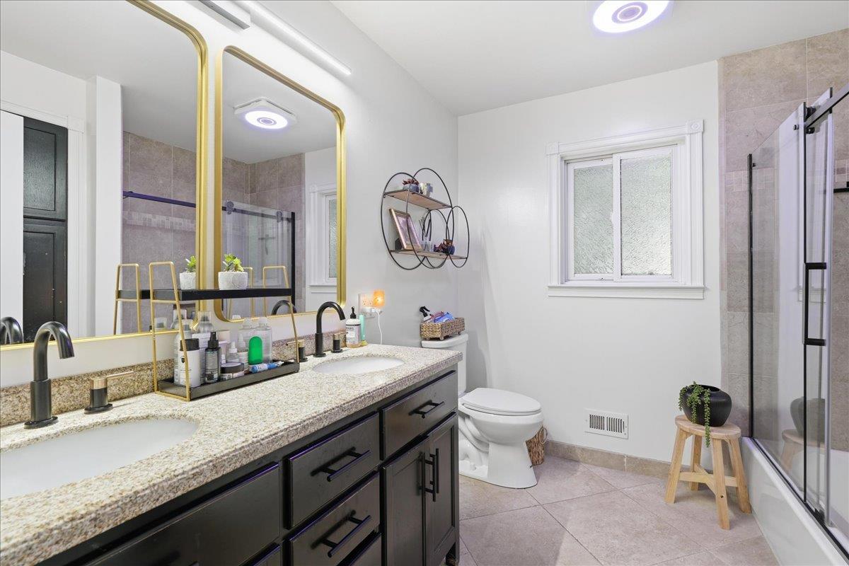 4849 Alexon Way Carmichael, CA 95608 - Photo 30 of 50 a bathroom with a granite countertop sink and a mirror