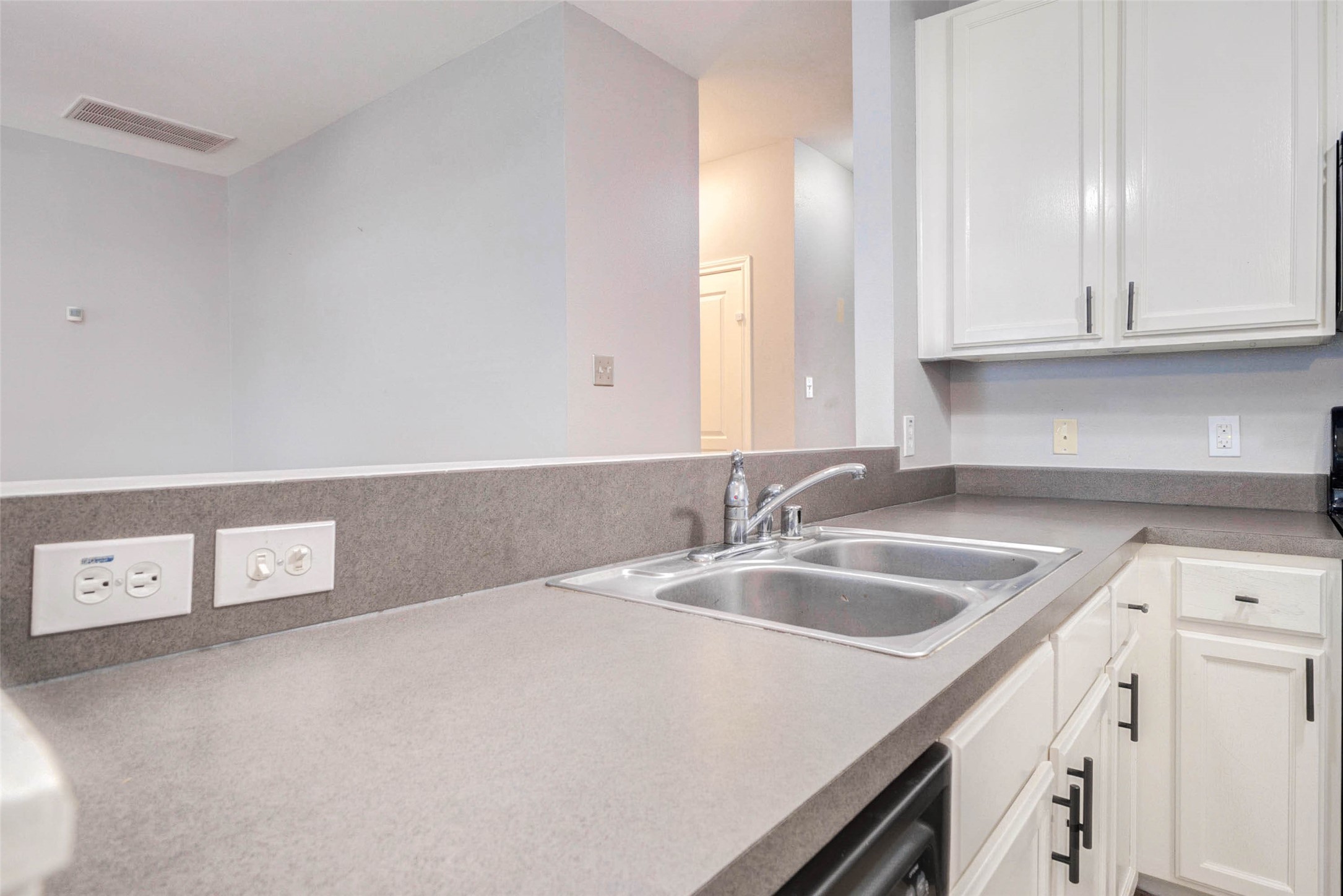14522 Durham Chase Lane Houston, TX 77095 - Photo 15 of 40 a kitchen with a sink and cabinets