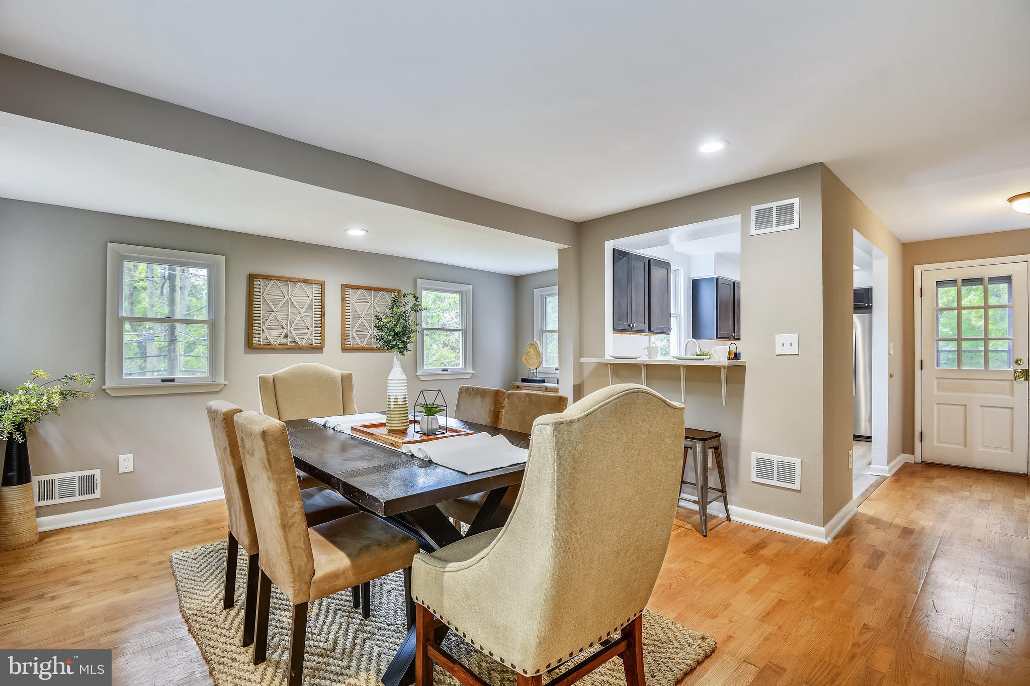 a dining room with furniture and window