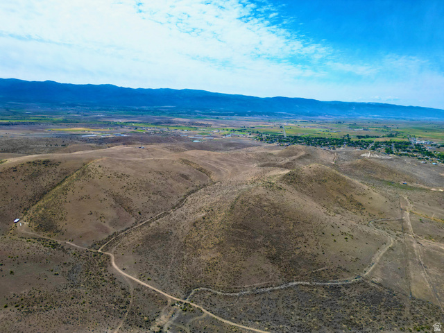 600 East E Street Moroni, UT 84646 - Photo 28 of 38 Expansive desert landscape featuring rolling hills and distant green valleys