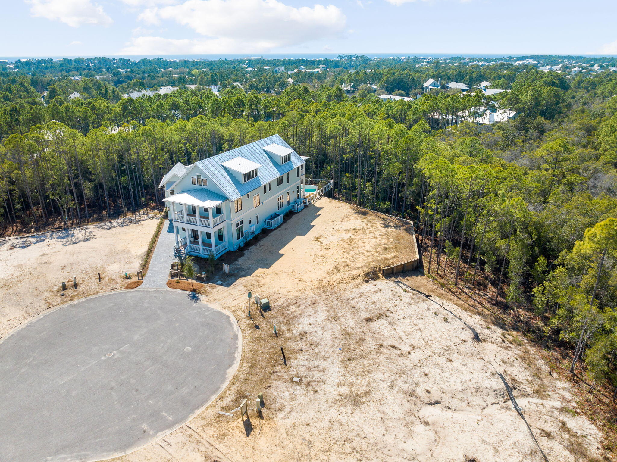 72 String Lily Cove Santa Rosa Beach, FL 32459 - Photo 16 of 25 a view of a backyard with sitting area