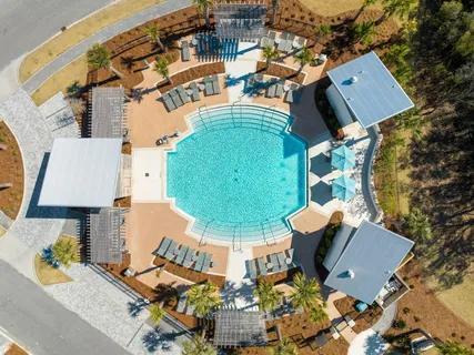 an aerial view of a house with a swimming pool
