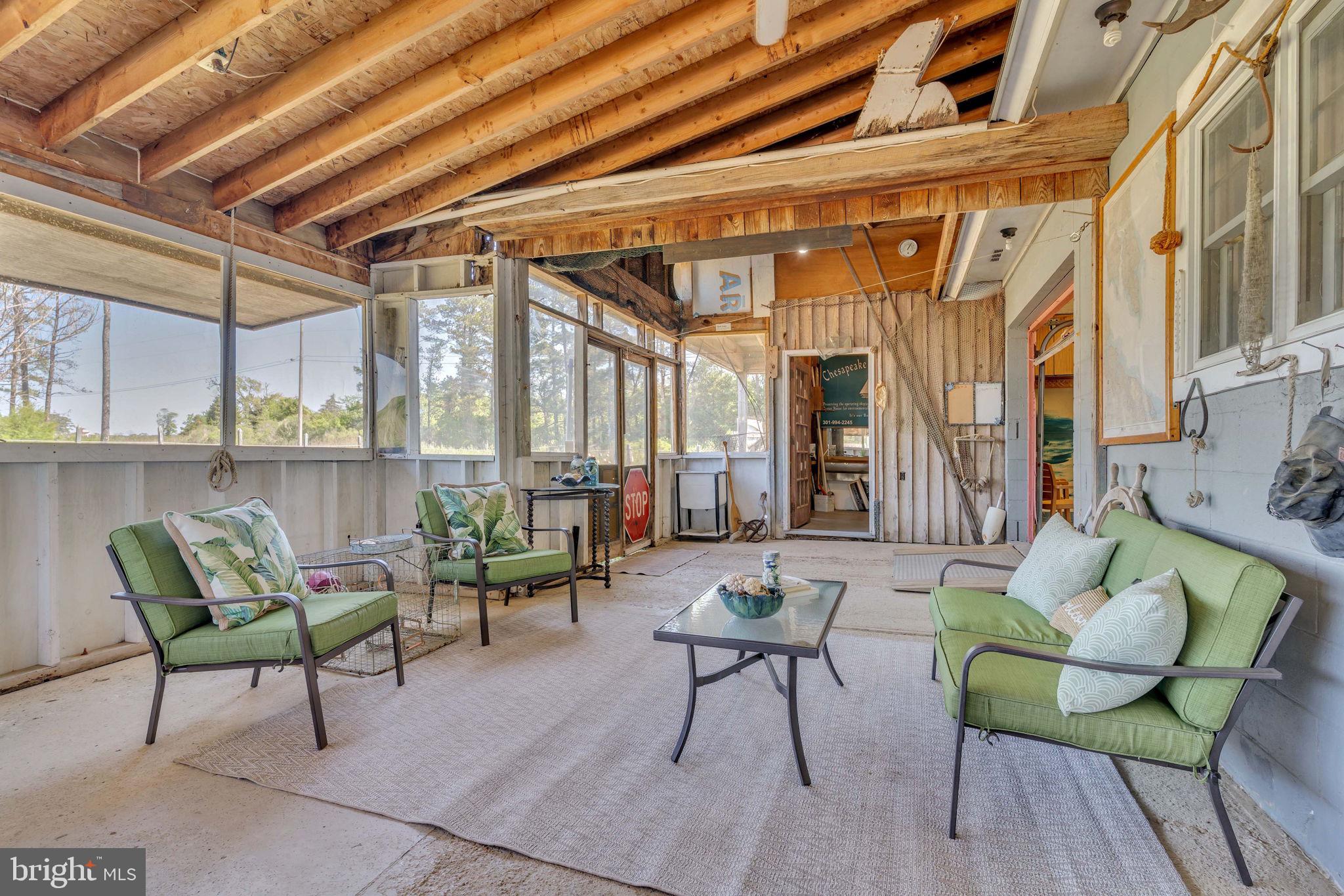 16129 Piney Point Road Piney Point, MD 20674 - Photo 14 of 50 a building outdoor space with patio furniture and potted plants