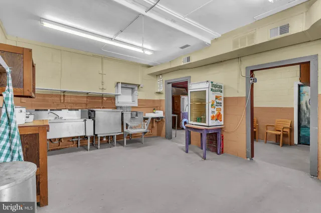 a large room with lots of furniture and windows