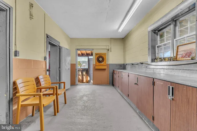 a kitchen with stainless steel appliances granite countertop a sink and cabinets