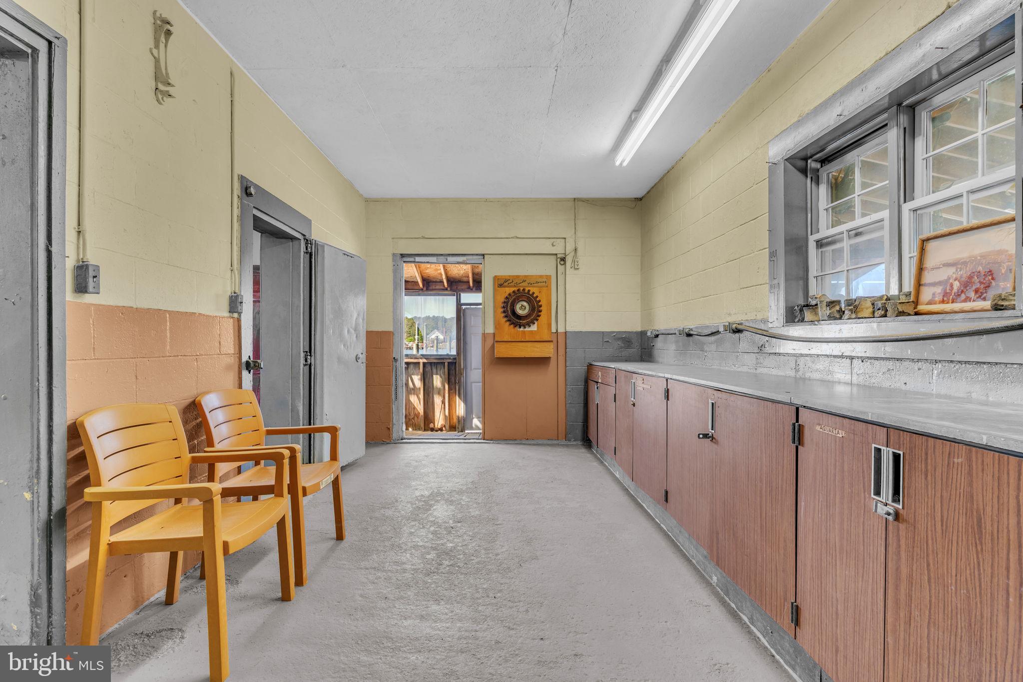 16129 Piney Point Road Piney Point, MD 20674 - Photo 26 of 50 a kitchen with stainless steel appliances granite countertop a sink and cabinets