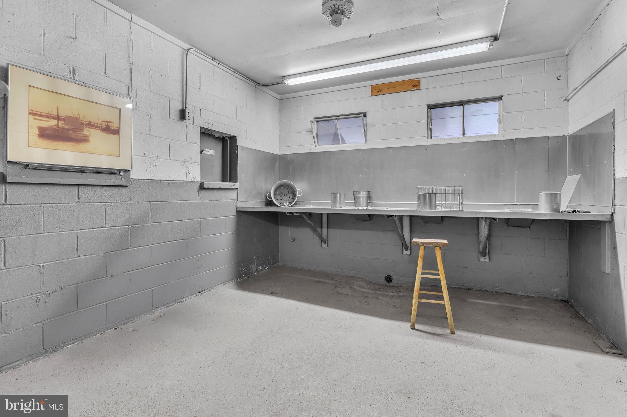 16129 Piney Point Road Piney Point, MD 20674 - Photo 27 of 50 a room with cabinets