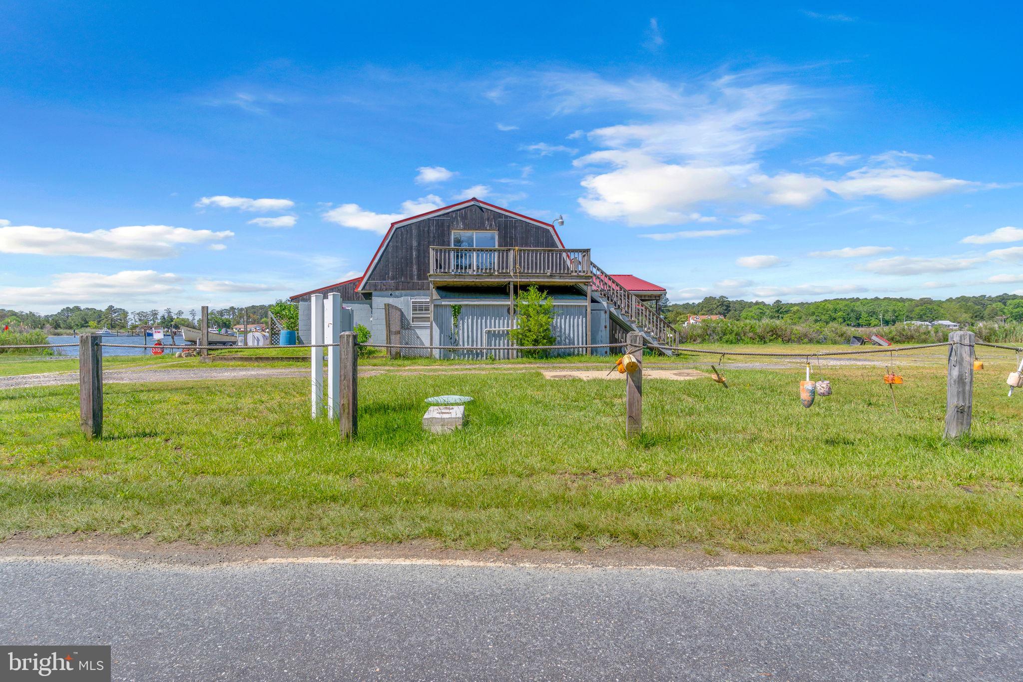 16129 Piney Point Road Piney Point, MD 20674 - Photo 3 of 50 a view of a garden with a houses