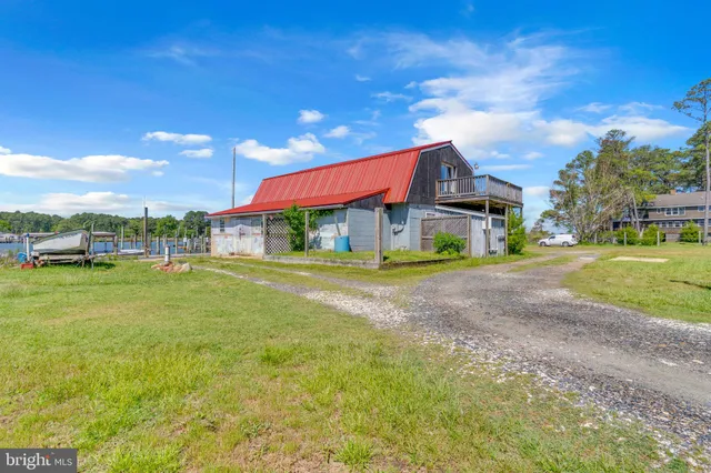 a view of a balcony with mountain view and wooden floor