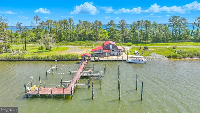 a view of a lake with lawn chairs