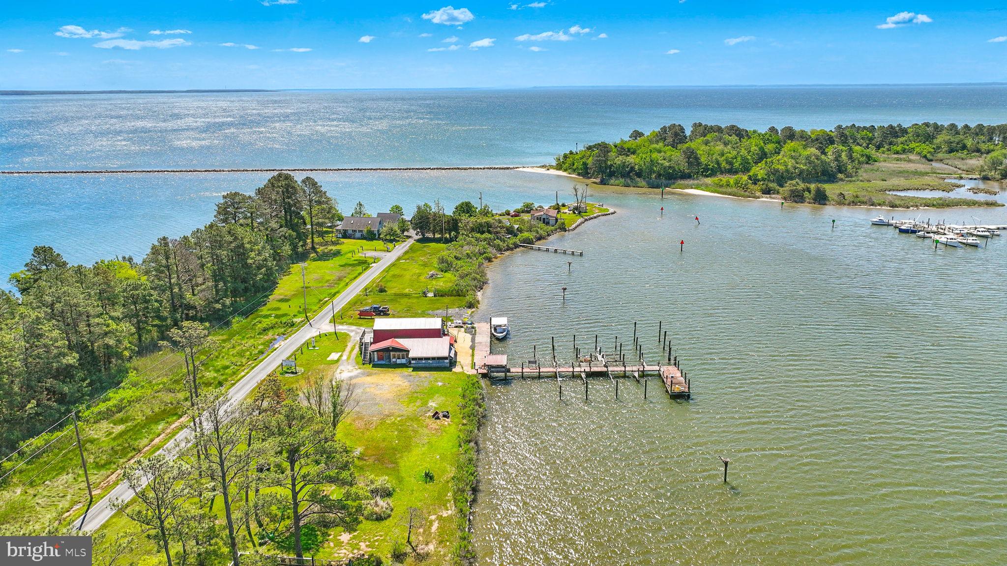 16129 Piney Point Road Piney Point, MD 20674 - Photo 41 of 50 a view of a swimming pool with an outdoor seating