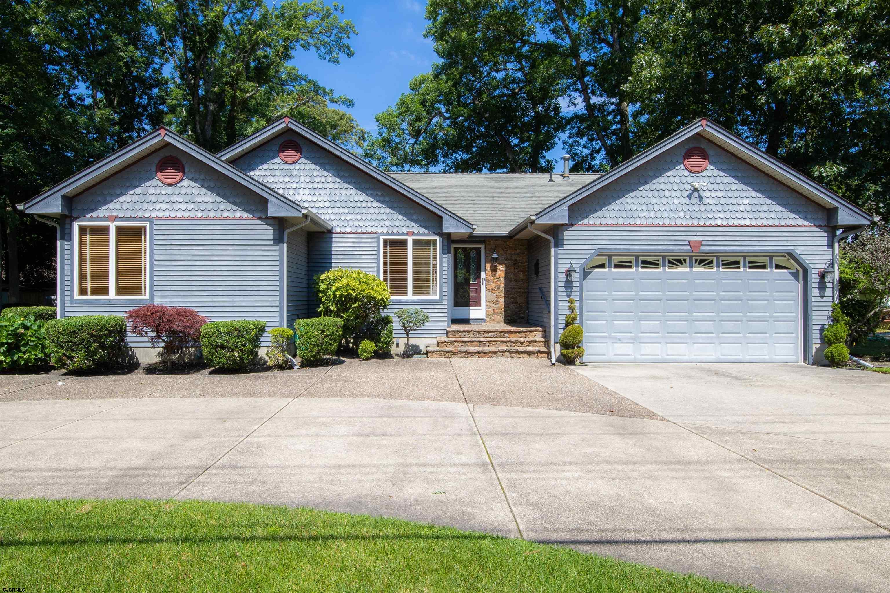 a front view of a house with yard