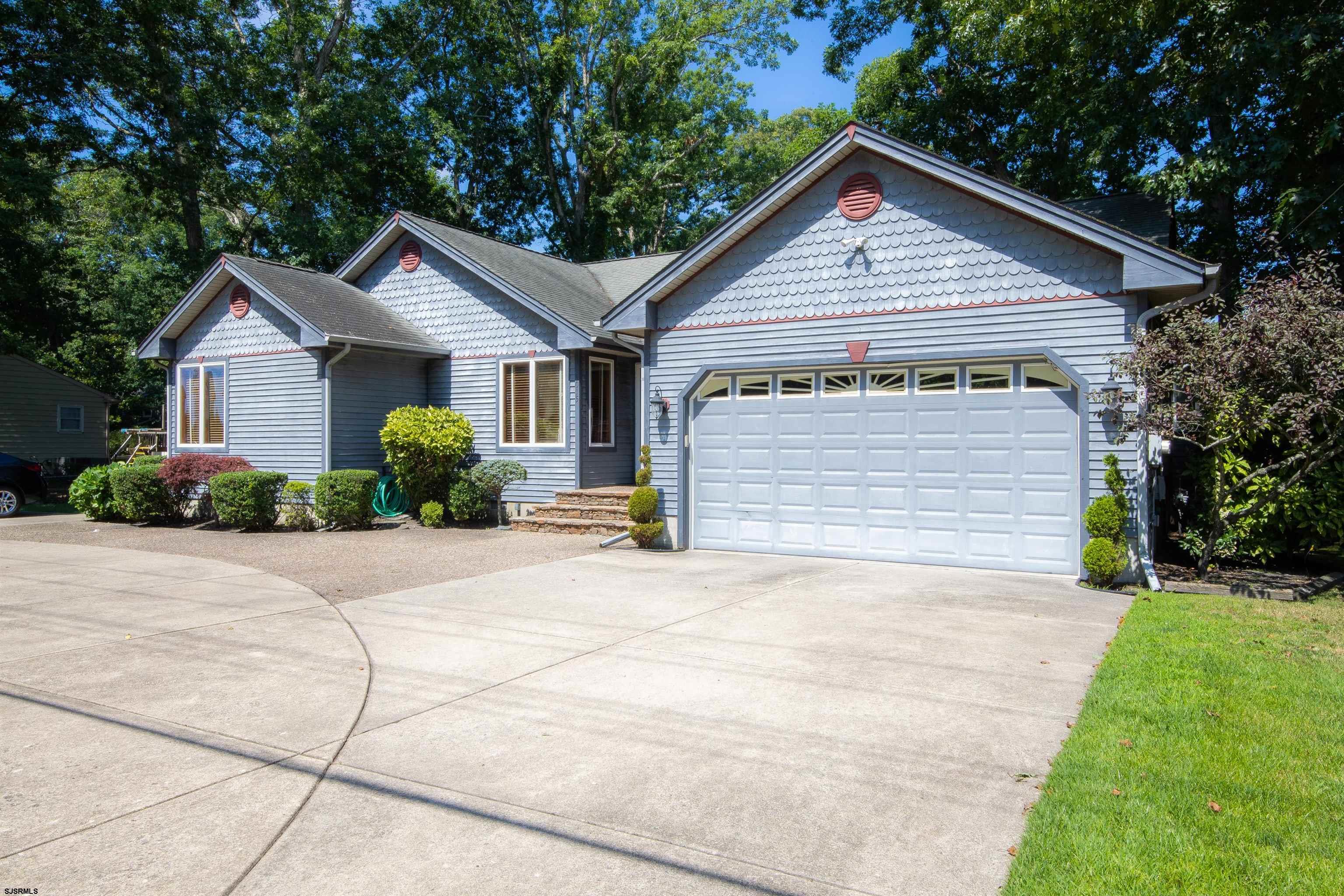1015 New Road Linwood, NJ 08221 - Photo 3 of 37 a view of garage yard and tree