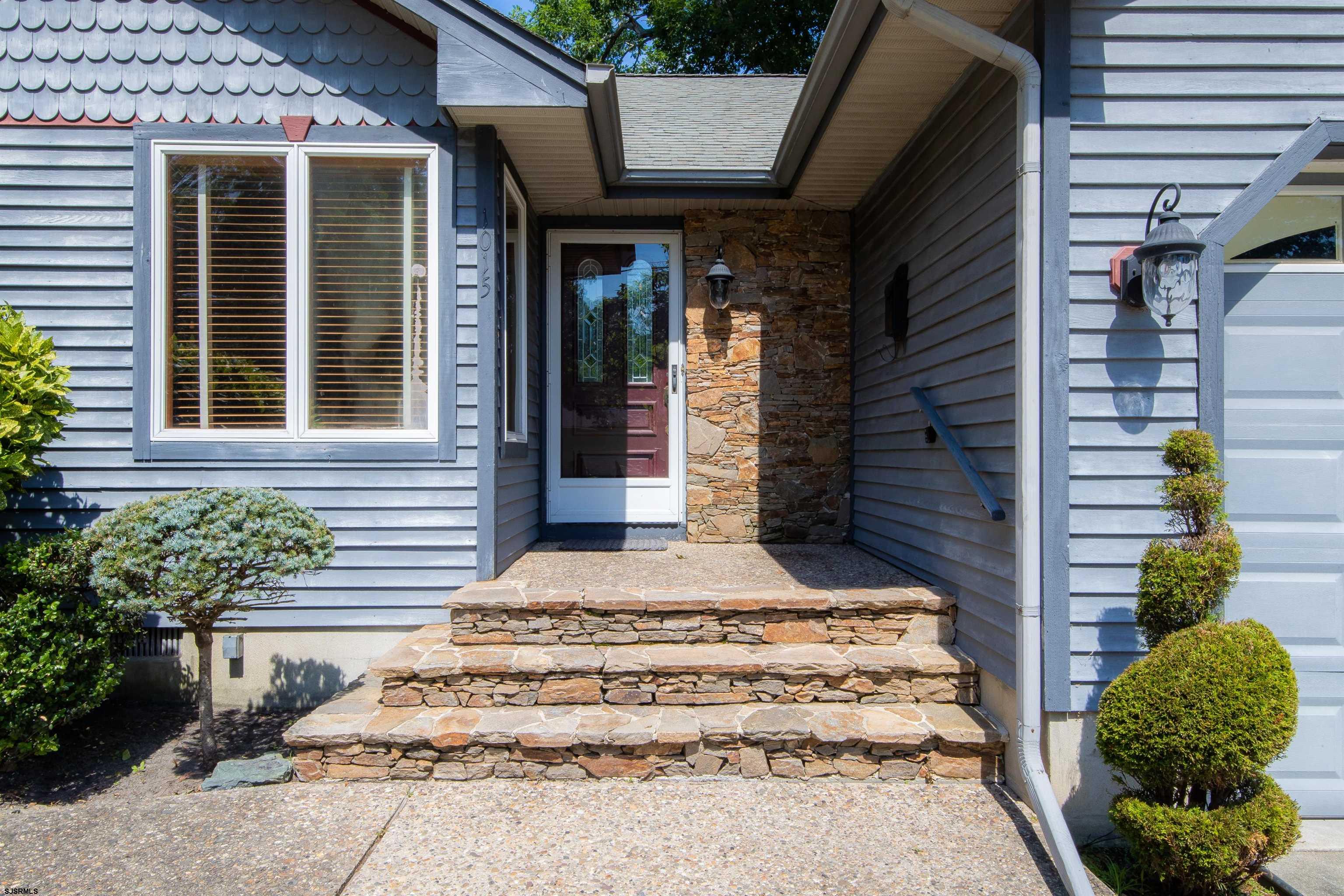 1015 New Road Linwood, NJ 08221 - Photo 4 of 37 a front view of a house with a garden