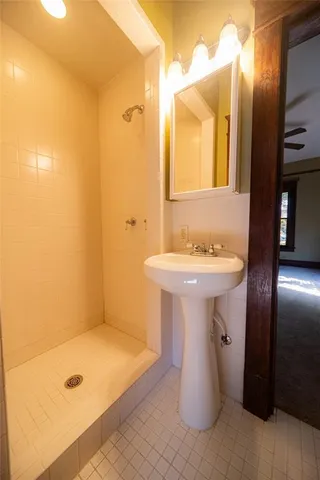 a bathroom with a sink and mirror