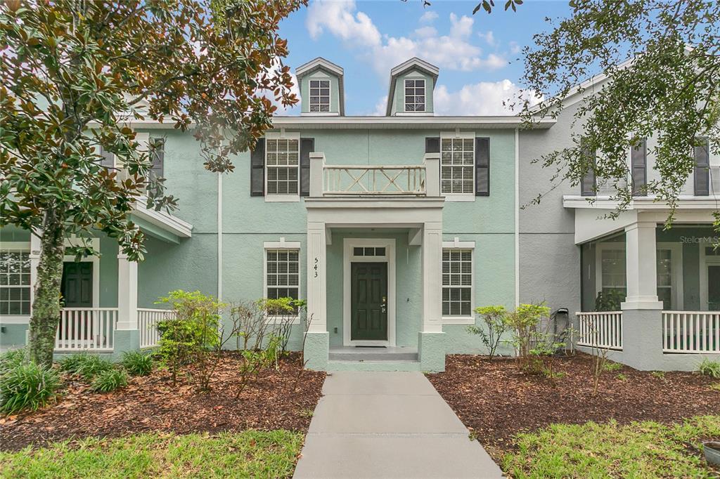 543 Rainbow Springs Loop Groveland, FL 34736 - Photo 1 of 26 a front view of a house with garden