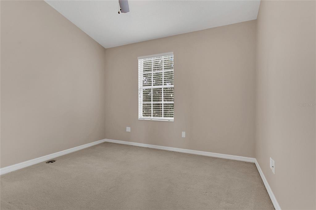 543 Rainbow Springs Loop Groveland, FL 34736 - Photo 20 of 26 a view of an empty room with a window