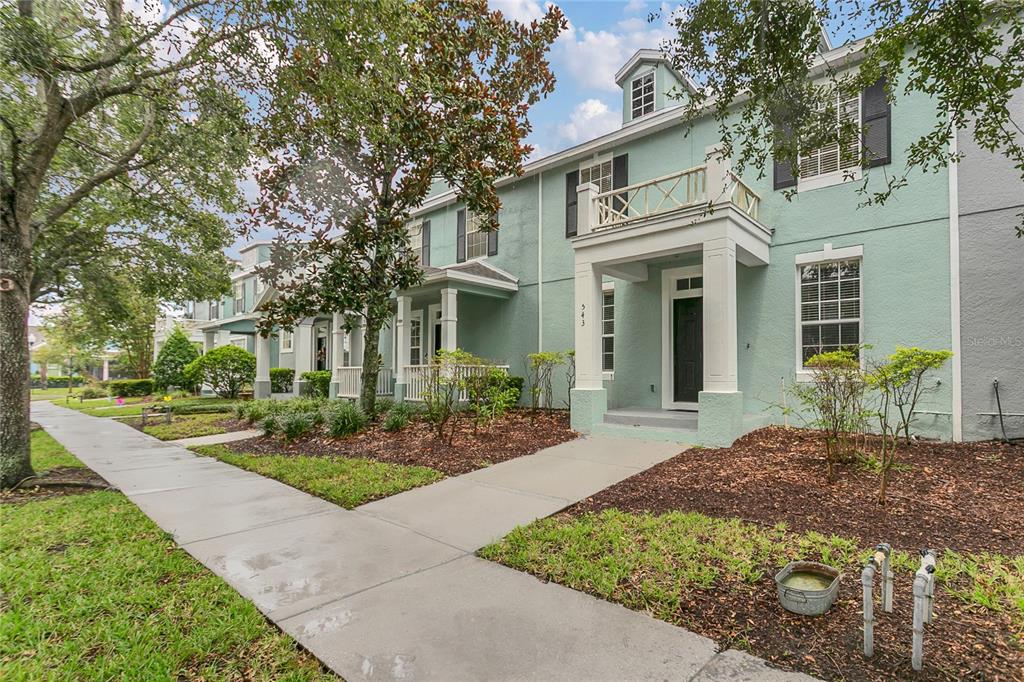 543 Rainbow Springs Loop Groveland, FL 34736 - Photo 2 of 26 a front view of a house with a yard