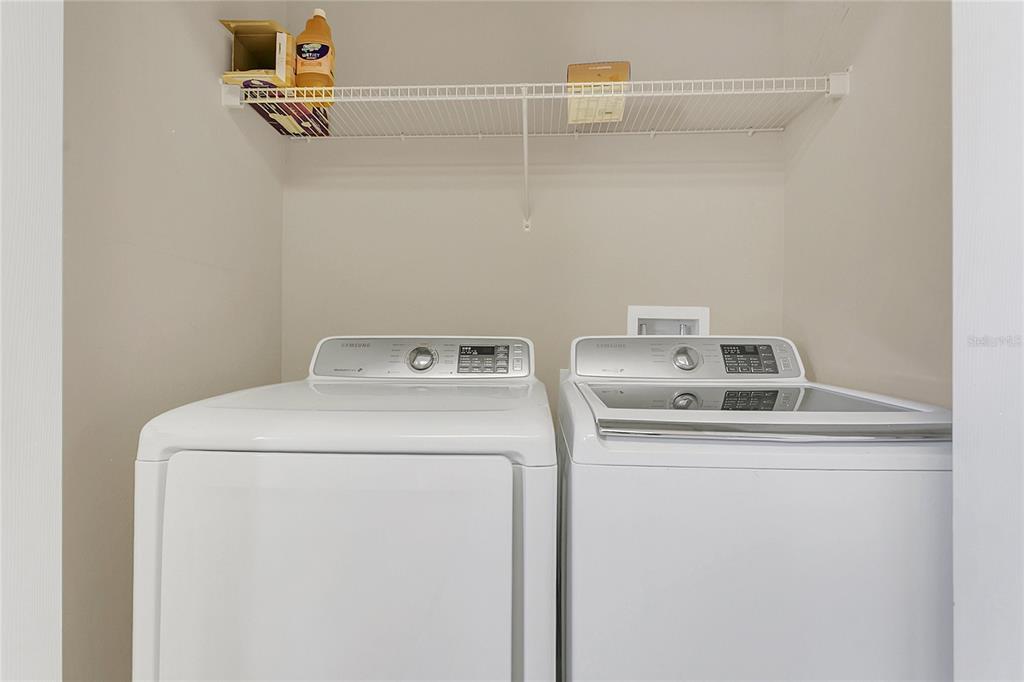 543 Rainbow Springs Loop Groveland, FL 34736 - Photo 22 of 26 a utility room with dryer and washer