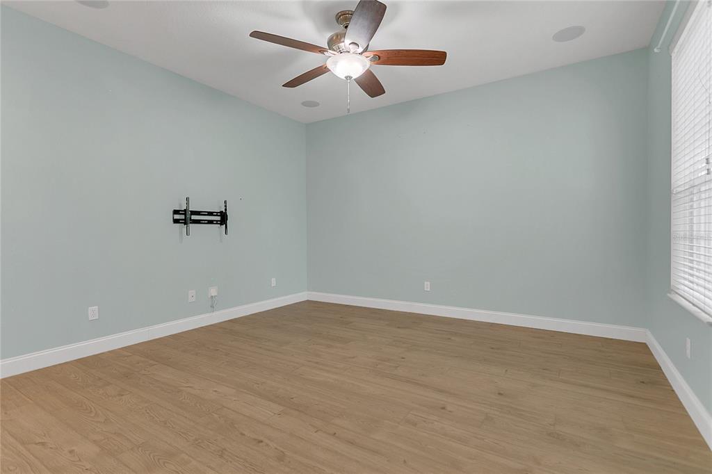 543 Rainbow Springs Loop Groveland, FL 34736 - Photo 7 of 26 an empty room with a window and a ceiling fan