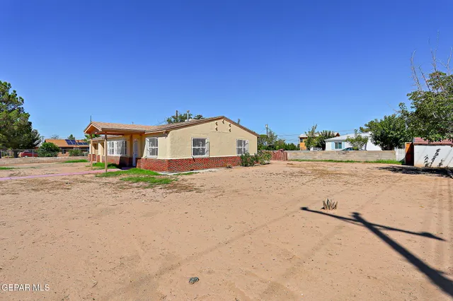 a view of a house with a road