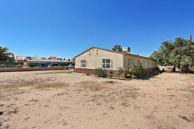 a view of a house with a snow on the road