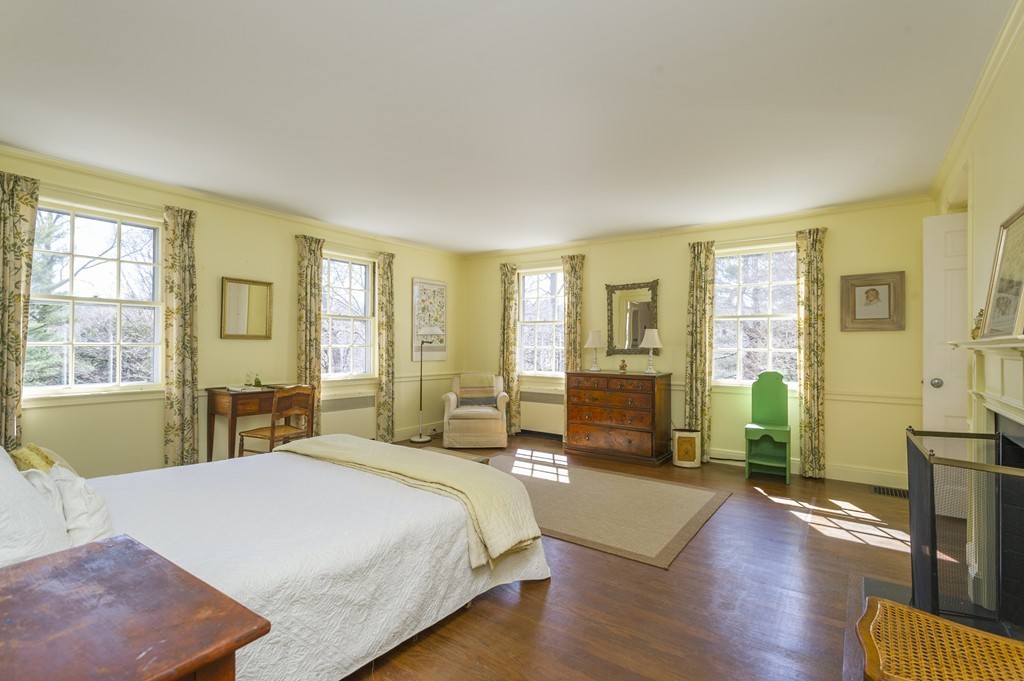 21 Sargent Crossway Brookline, MA 02445 - Photo 9 of 15 a spacious bedroom with a large bed and a large window