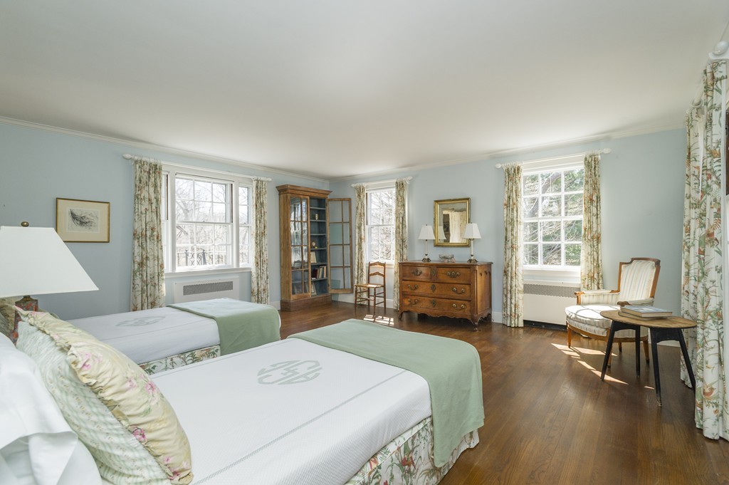 21 Sargent Crossway Brookline, MA 02445 - Photo 10 of 15 a bedroom with a bed large window and a couch