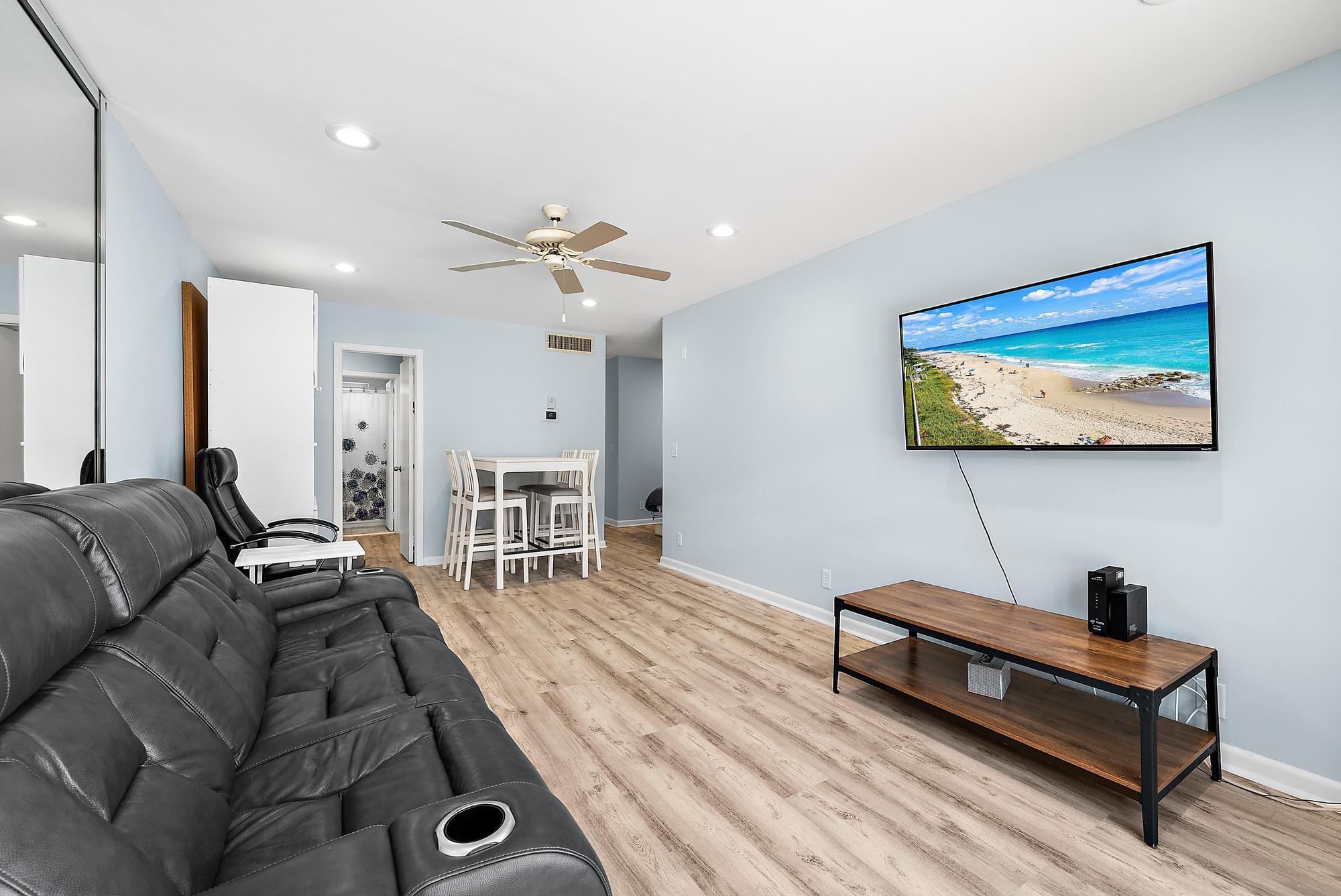 3851 North Ocean Boulevard, Unit 202 Gulf Stream, FL 33483 - Photo 12 of 20 a living room with furniture