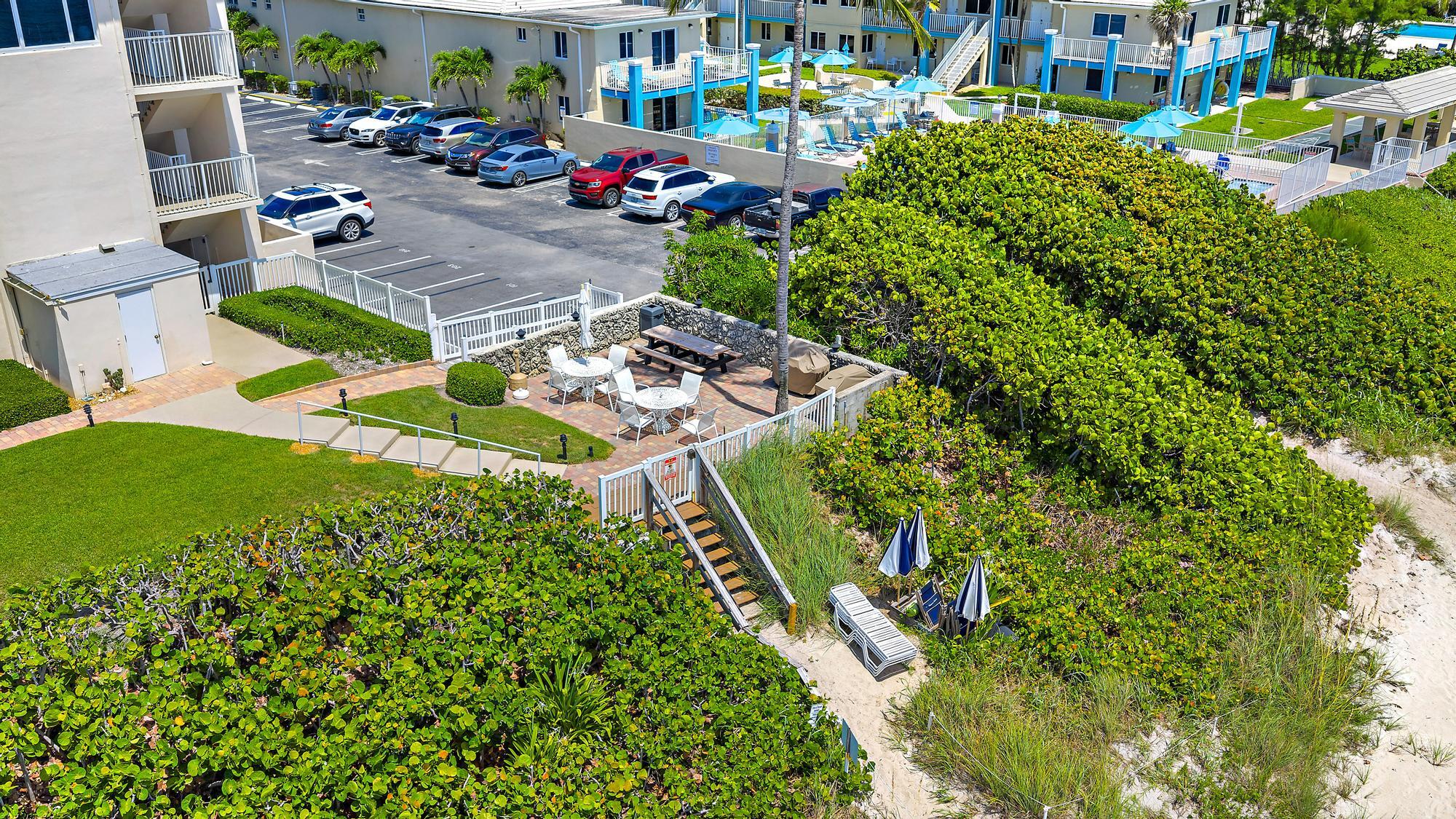 3851 North Ocean Boulevard, Unit 202 Gulf Stream, FL 33483 - Photo 16 of 20 an aerial view of a house with a garden