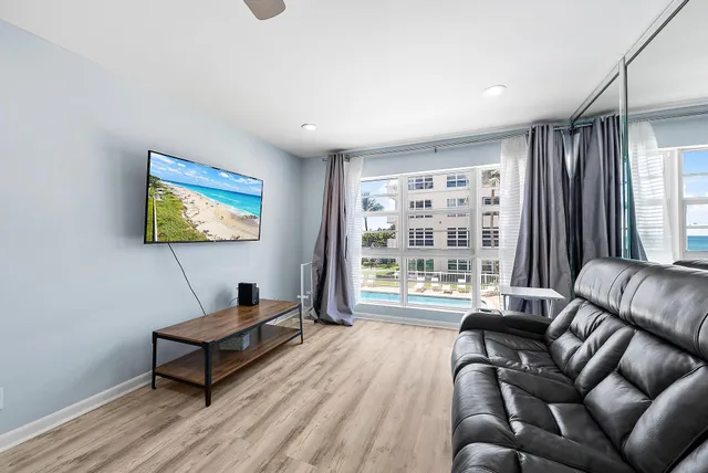 a living room with furniture and a window