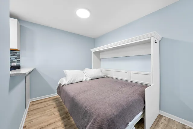 a bedroom with a bed and utility room