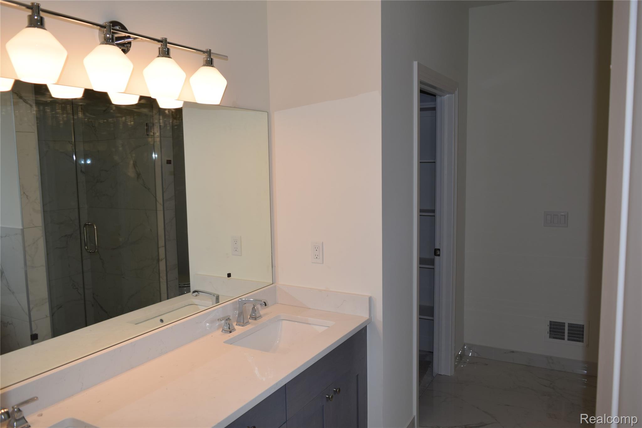 3093 Raffler Drive Rochester, MI 48307 - Photo 29 of 34 Bathroom with a marble finish shower and double vanity