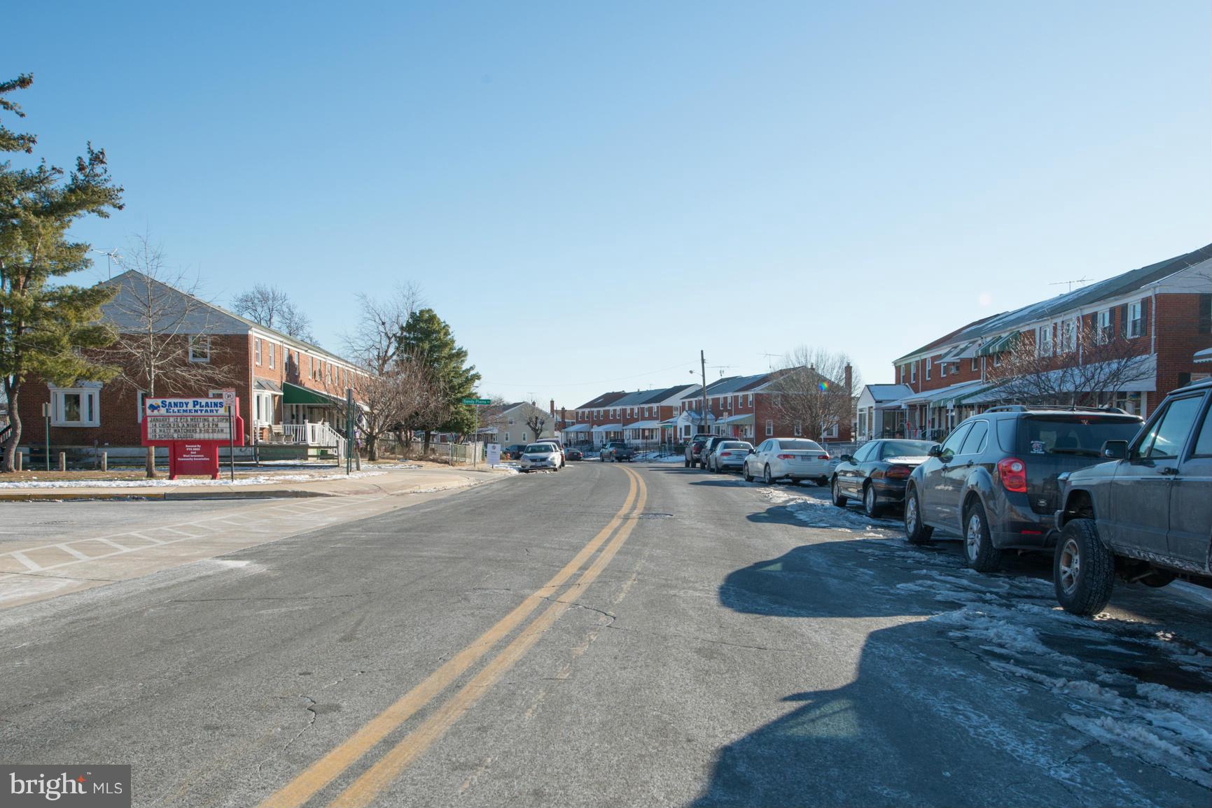 8331 Kavanagh Road Baltimore, MD 21222 - Photo 28 of 28 a city street lined with buildings and cars