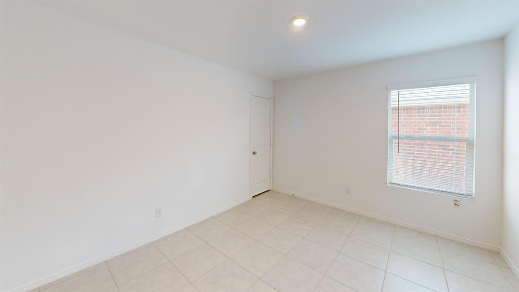 14065 Haggerston Drive Pilot Point, TX 76258 - Photo 13 of 21 an empty room with a window