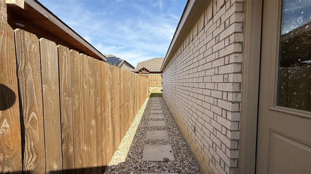 14065 Haggerston Drive Pilot Point, TX 76258 - Photo 18 of 21 a view of a pathway of a house