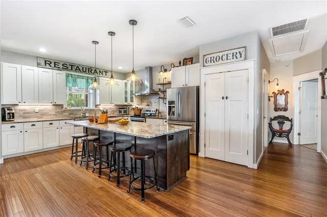 a kitchen with granite countertop counter space a sink appliances and cabinets