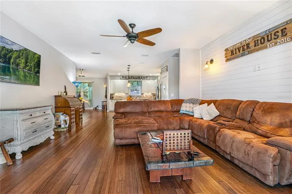 a spacious bedroom with a bed and a table in it