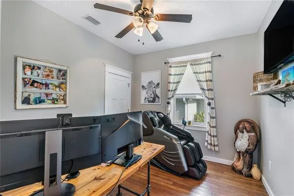 a bedroom with two beds and a chandelier