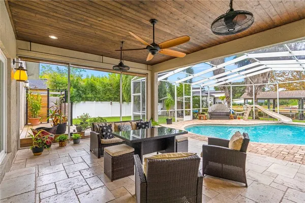 a view of a swimming pool with a patio