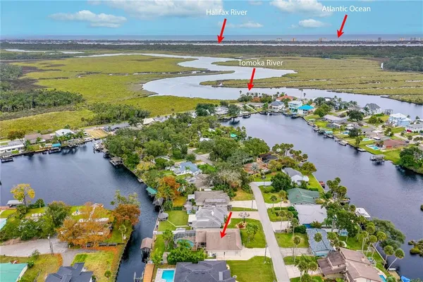 a view of swimming pool with outdoor seating and garden