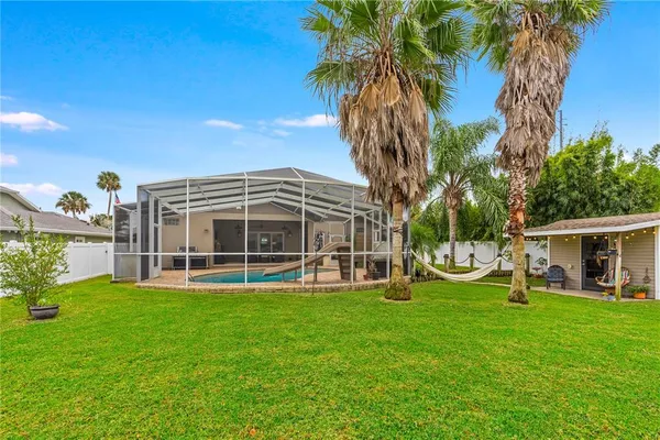 a kitchen with a refrigerator and table